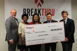 Bob Drinon, Breakthru Beverage Group South Region president, left, presented Step Up For Students with a check Tuesday for $65 million which will provide 11,000 low-income children with scholarships to attend the K-12 school of their choice. With him from left to right are Step Up For Students graduate Denisha Merriweather, State Rep. Daphne Campbell, D-Miami, Breakthru CFO Eric Roth and Step Up For Students President Doug Tuthill
