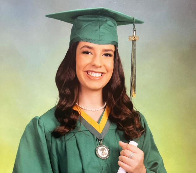 headshot of girl wearing green cap and gown